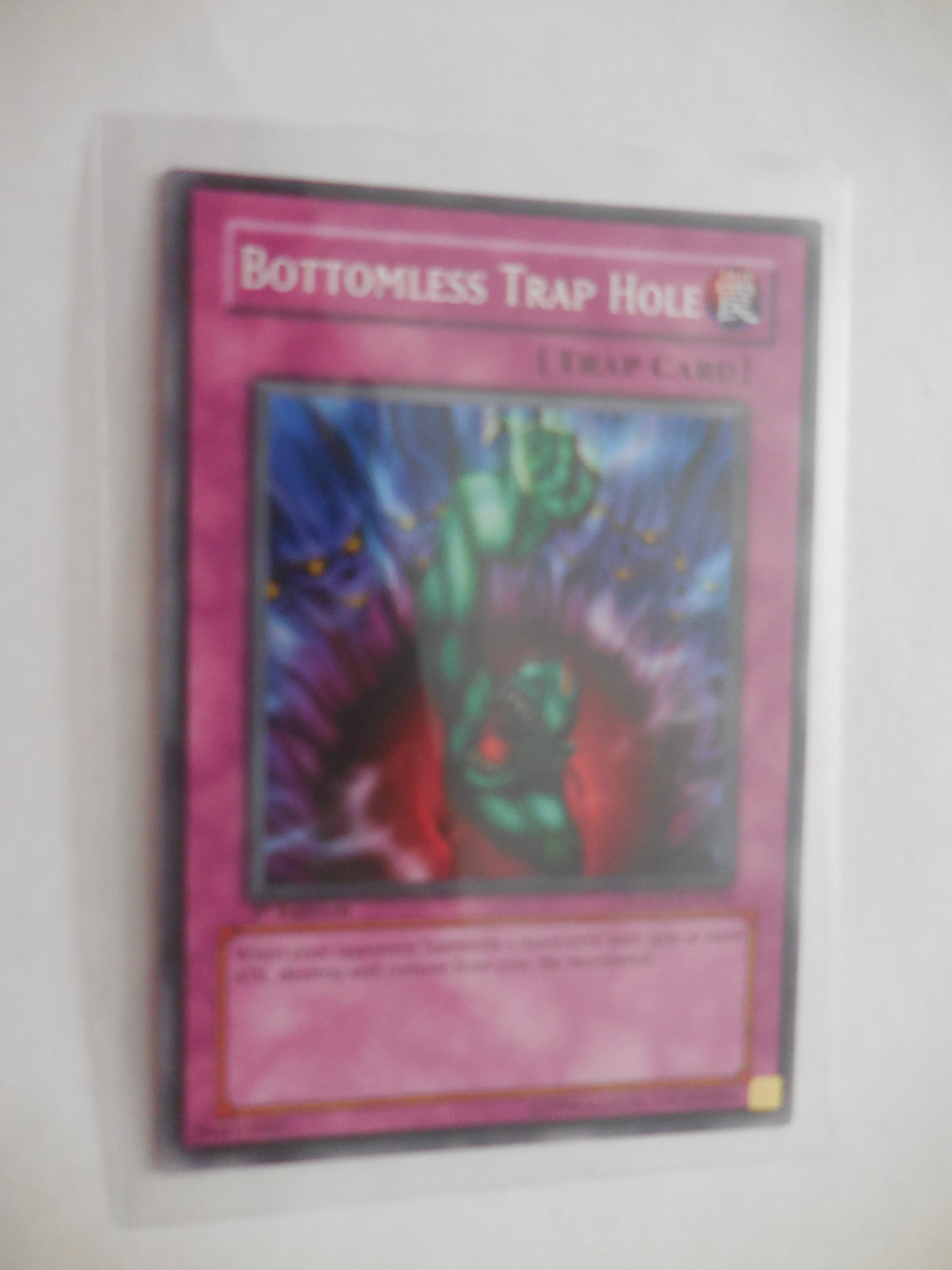 BOTTOMLESS TRAP HOLE COMMON 1ST EDITION